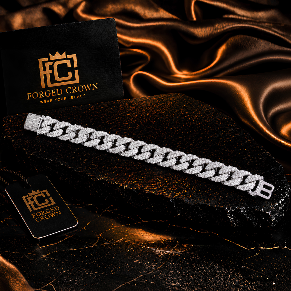 Moissanite link bracelet in S925 sterling silver with platinum finish, featuring pave clasp detail on a black stone slab with Forged Crown branding