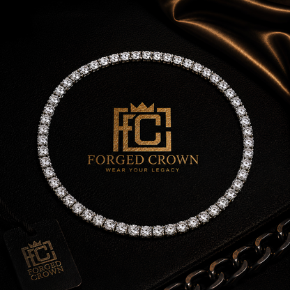 Moissanite tennis necklace in S925 sterling silver with platinum finish, featuring a continuous row of round stones displayed on black textured surface with Forged Crown 