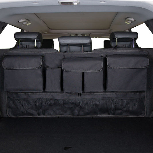 Vehicle trunk with a rear seat hanging storage organizer with multiple compartments