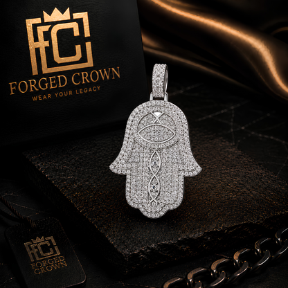 Moissanite pavé hand pendant in S925 sterling silver with platinum finish featuring dense stone setting and structured surface design.
 Hamsa hand pendant with 'Forged Crown' logo in the background