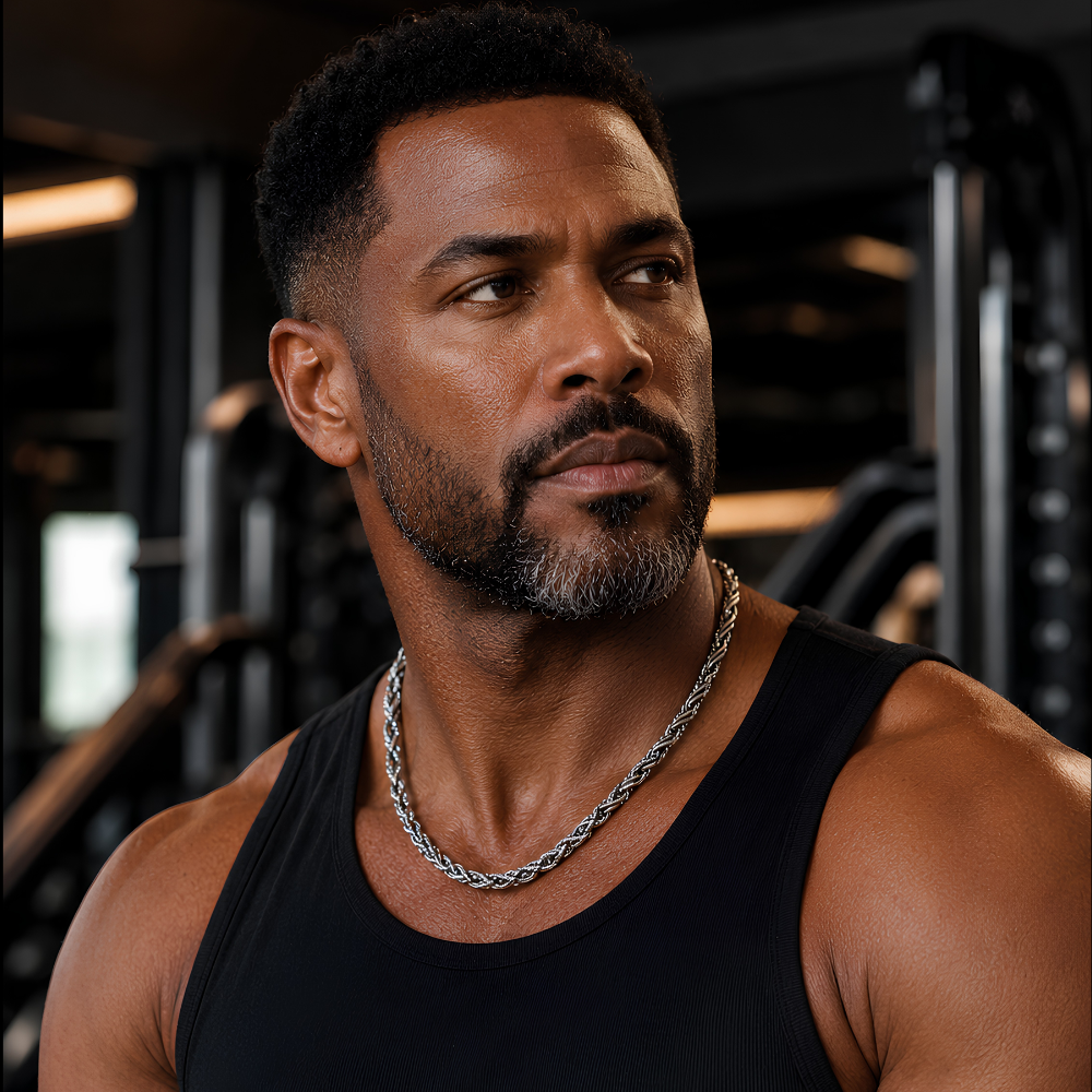 Man wearing a black tank top and 7mm sterling silver rope chain necklace in S925 featuring twisted link design and heavy structured form in a gym setting Forged Crown