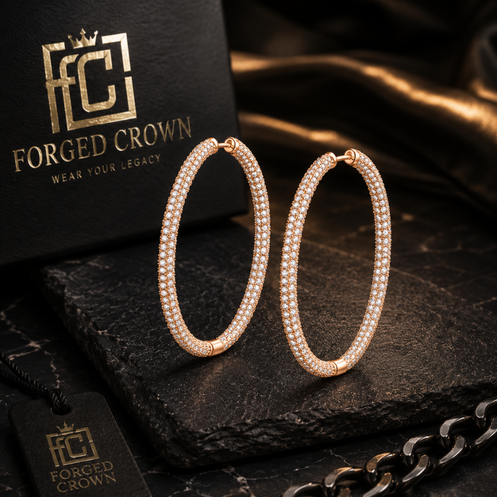 Gold round moissanite hoop earrings in S925 sterling silver with full surface sparkle and hinged closure on a dark surface with 'Forged Crown' branding