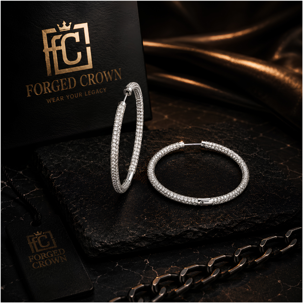 Close up of pave moissanite hoop earrings in silver with secure clasp on a dark surface with 'Forged Crown' branding.