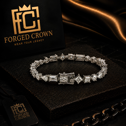 Moissanite mixed cut tennis bracelet in S925 sterling silver with platinum finish, displayed on textured black slab with Forged Crown 
