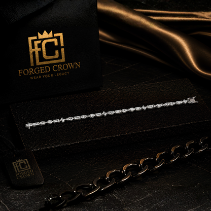 Moissanite mixed cut tennis bracelet in S925 sterling silver with platinum finish, displayed on textured black slab with Forged Crown 