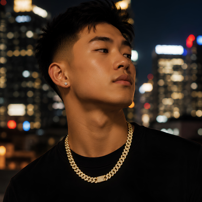 Man wearing a gold finished S925 sterling silver moissanite cube‑link chain with structured, architectural links and a modern, masculine profile.