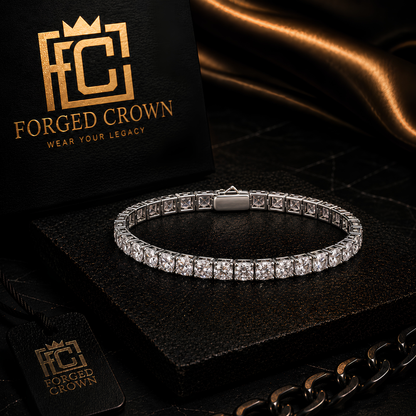 Moissanite Universal Gravitation tennis bracelet in platinum-finished S925 sterling silver, shown on textured black slab with Forged Crown 