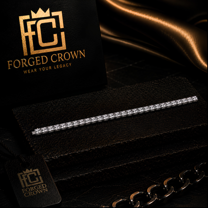 Moissanite Universal Gravitation tennis bracelet in platinum-finished S925 sterling silver, shown on textured black slab with Forged Crown 