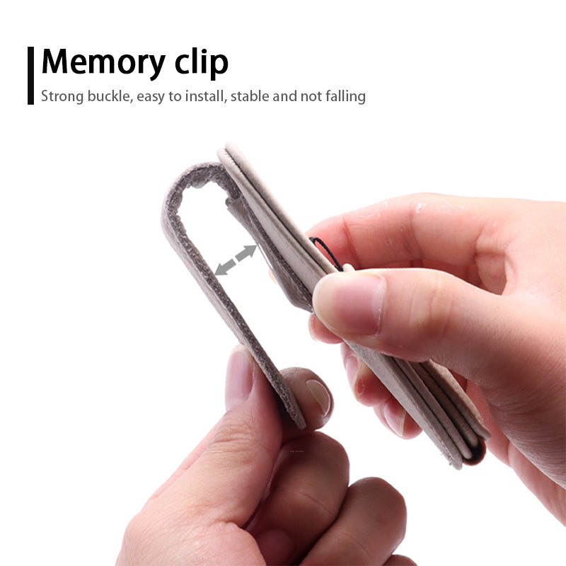 Close-up of visor clip holder showing leather surface and secure grip design